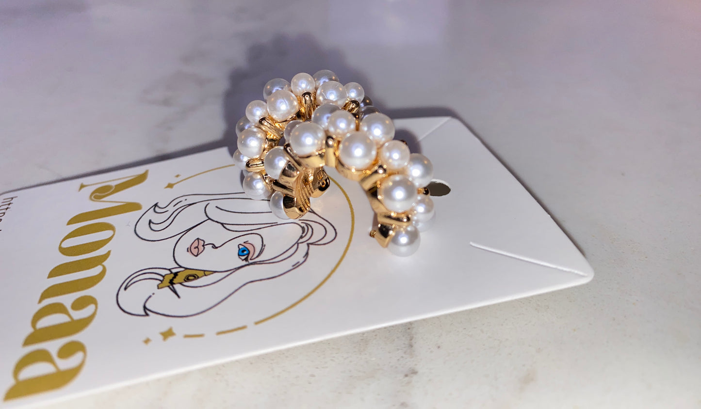 Modern Glam: Gold pearls loop earrings.