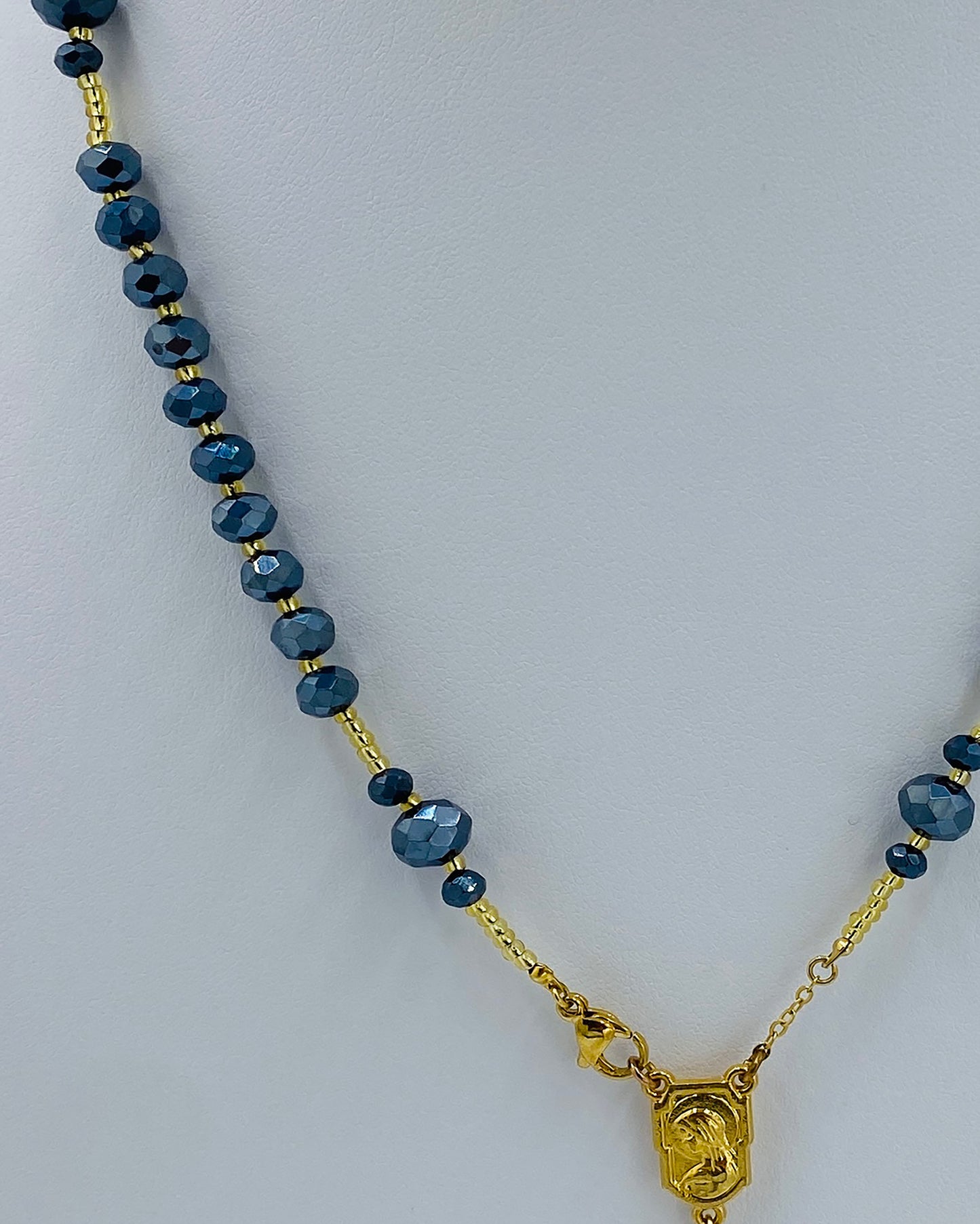 Gold Cross Necklace with matching Earrings.