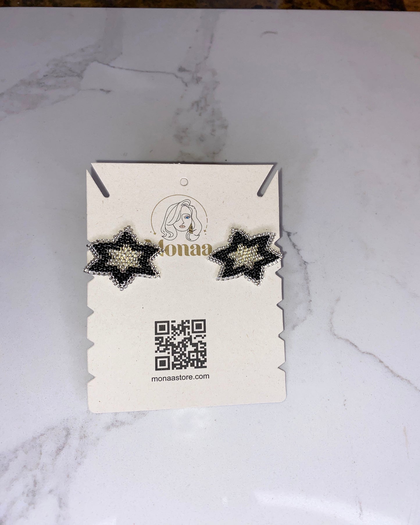 Stellar Style: Black and White Star Beaded Earrings.